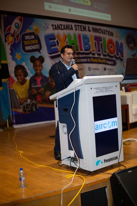 International speaker at the Tanzania STEM & Innovation Exhibition podium