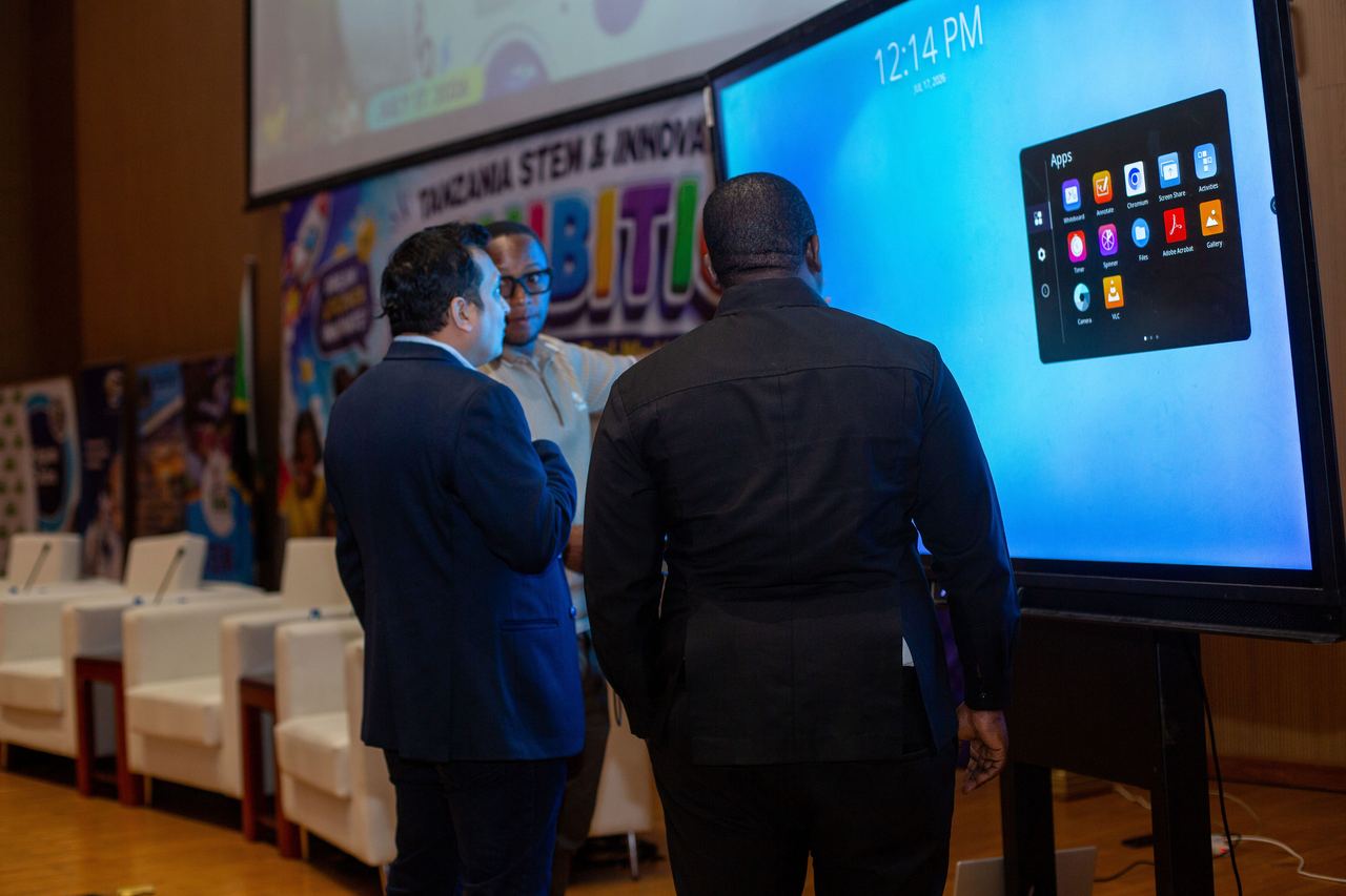 Guests exploring classroom apps on a smart screen at the exhibition